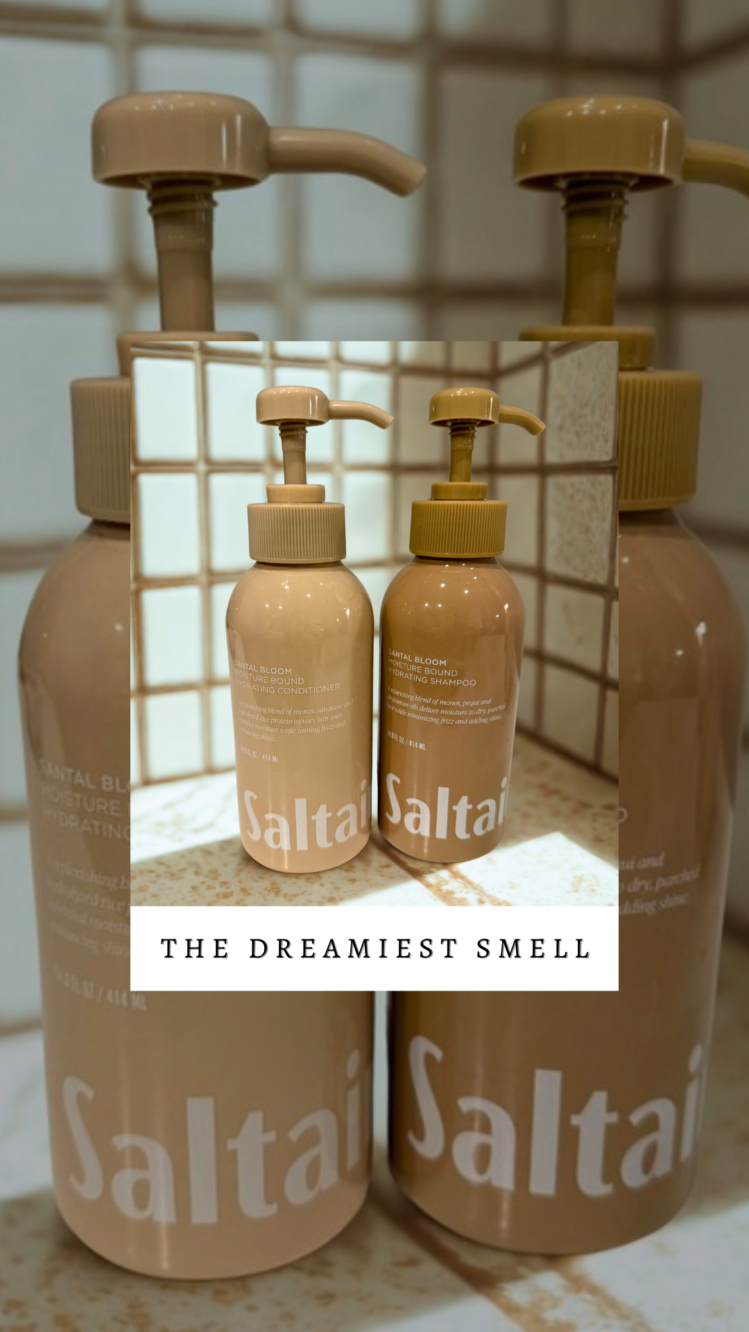 Two beige bottles of Saltai moisturizing products, a conditioner and a shampoo, with pump dispensers, placed on a tiled surface against a tiled wall with a mirror reflection and a caption reading 'The Dreamiest Smell'.