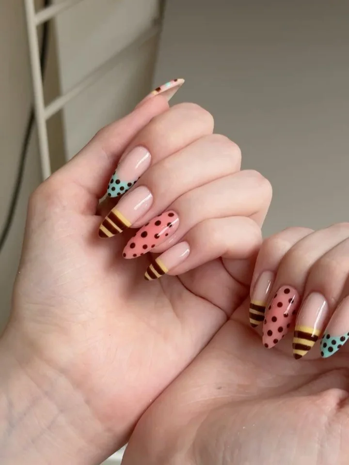 Polka dots, pastel tips, and a little bit of fun. ✨  Save this for your next appointment.

#TwoCoats #NailArt #SummerNails #RetroNails #PastelNails GlasgowNails NailInspo BIABNails NailDesign