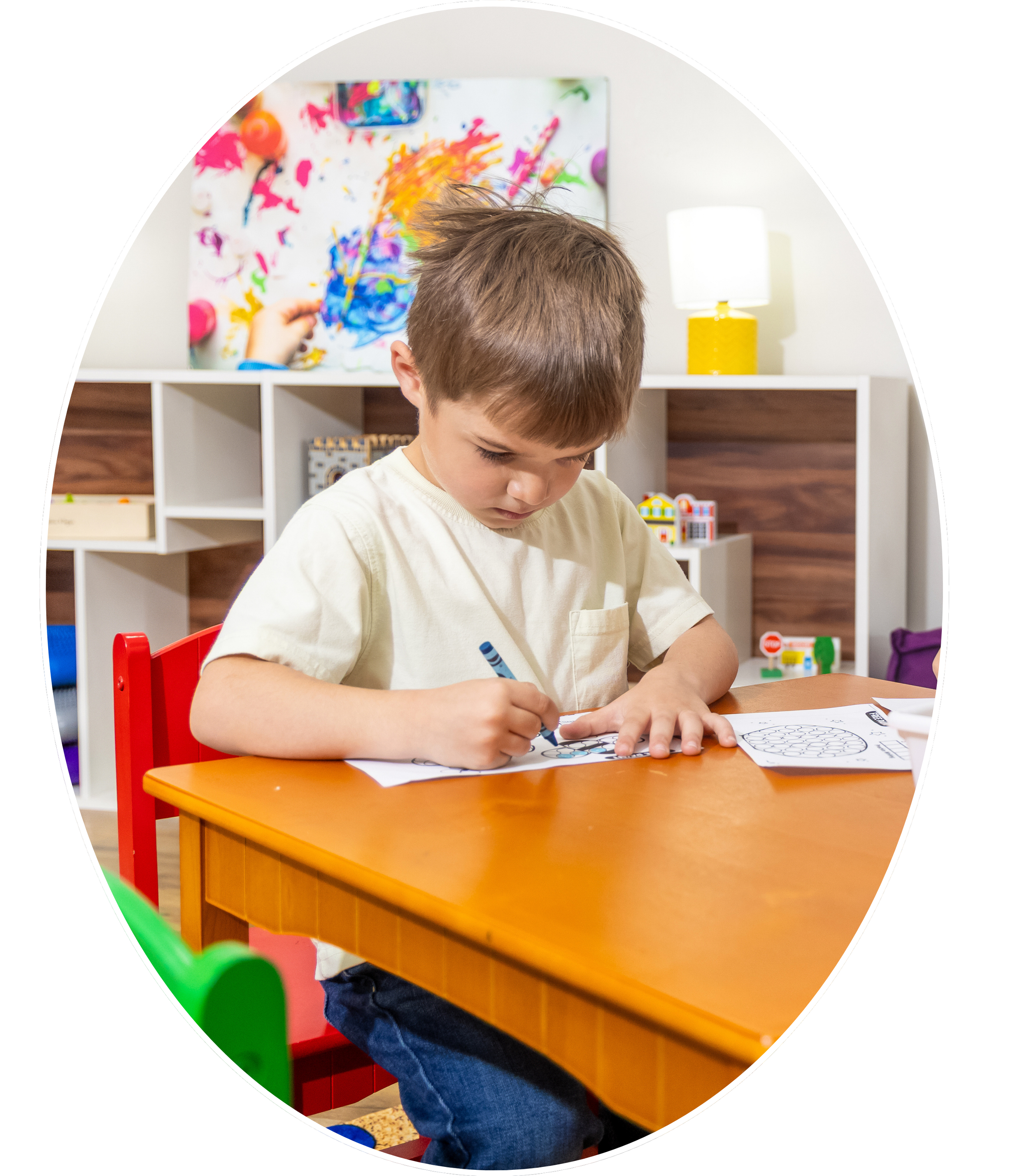 Child engaging in art therapy with paint in Madison and Huntsville, Alabama