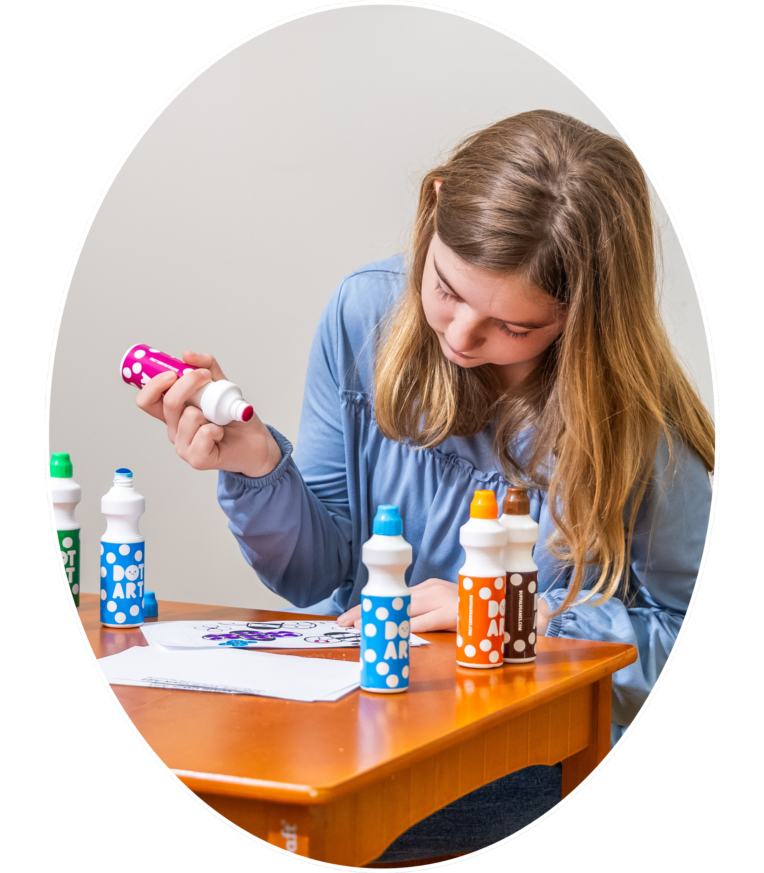 Young girl painting during play therapy session in Madison and Huntsville, Alabama