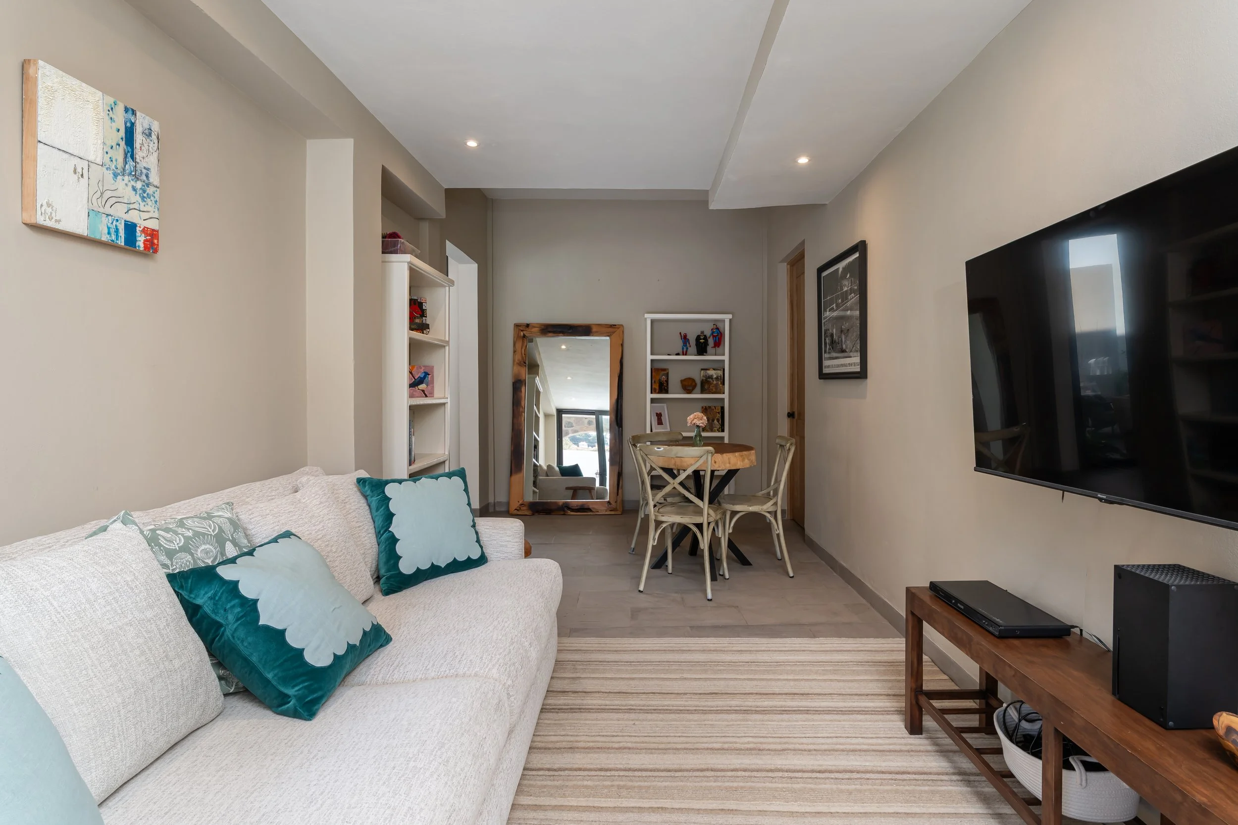 First-floor TV room seen from pool side