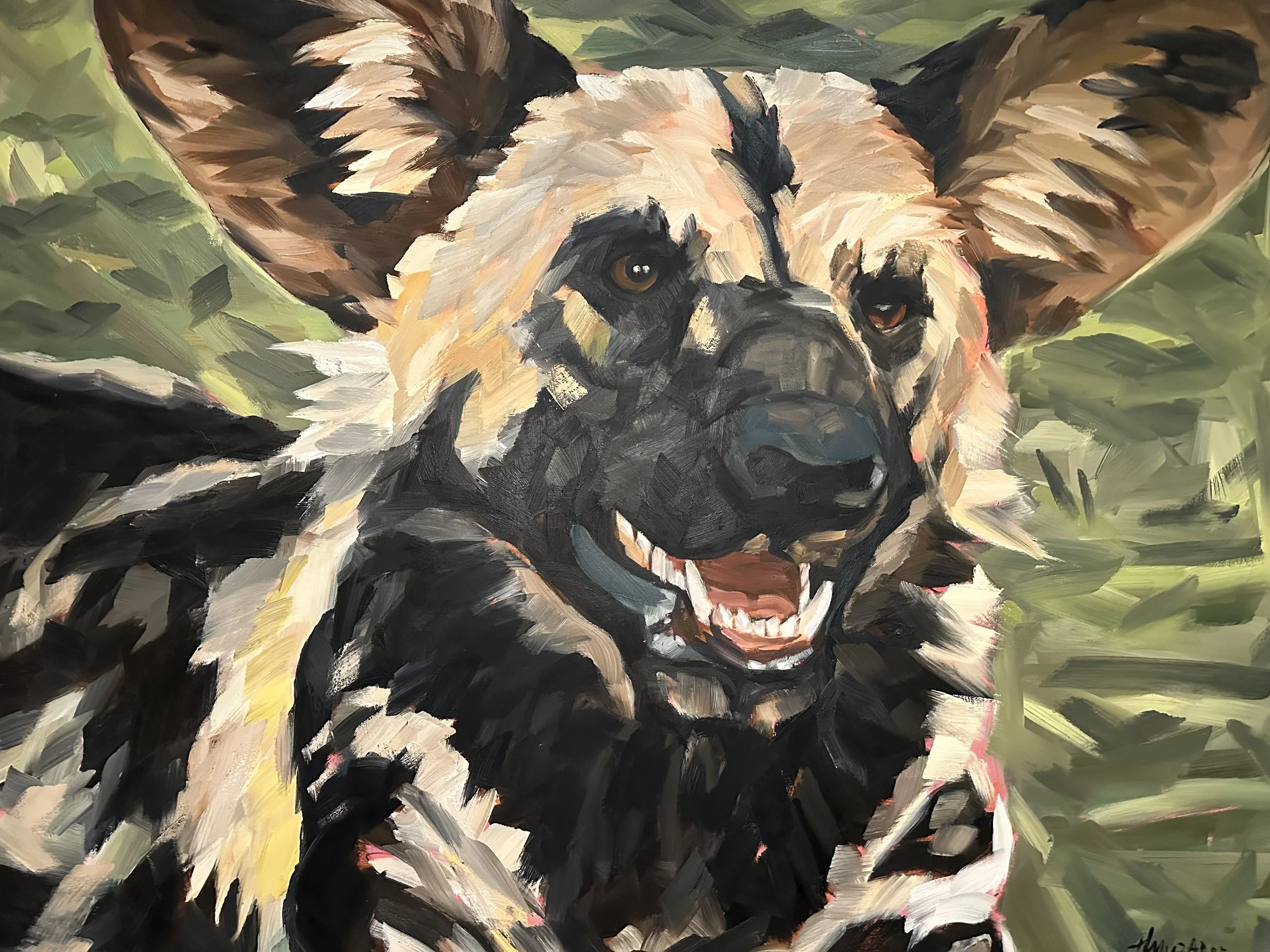 A painting of a happy, smiling German Shepherd dog with expressive eyes, surrounded by green foliage.