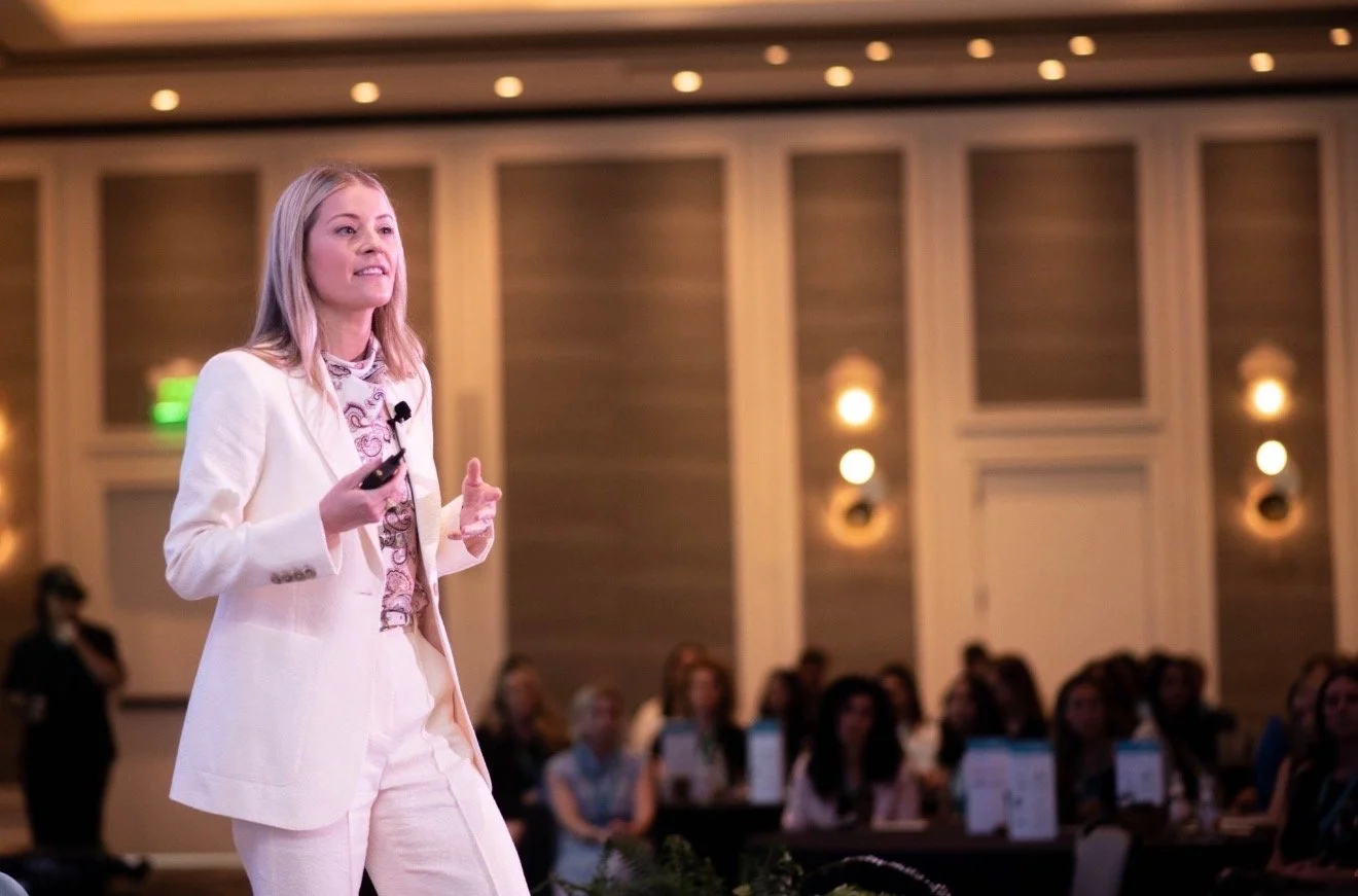 Laura presenting to a women's cyber insurance conference in New Orleans at the Four Seasons Hotel