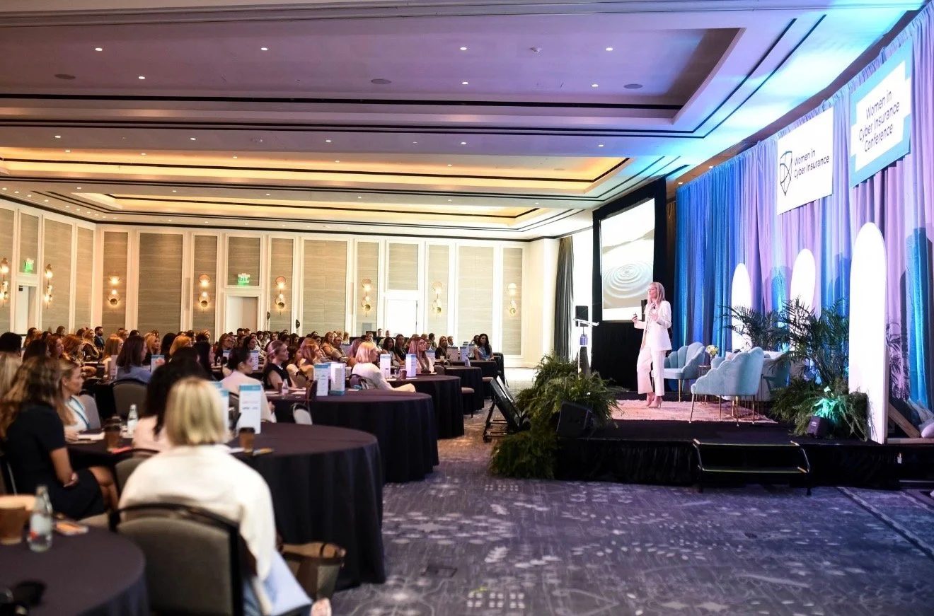 Laura presenting to a women's cyber insurance conference in New Orleans at the Four Seasons Hotel