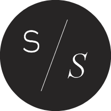 Black circular logo with white text 'S' and 'S' separated by a diagonal slash