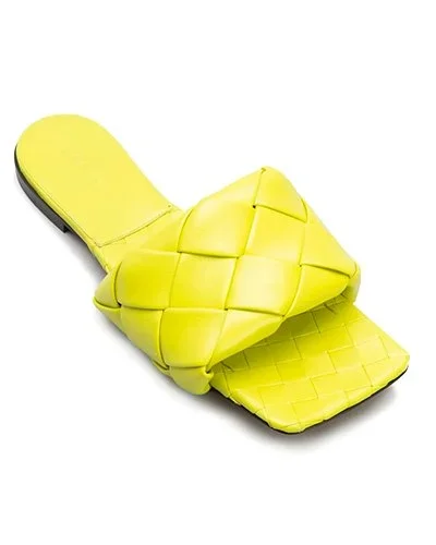 BOTTEGA VENETA The Lido Flat Sandals  Slip into these pillow cloude-like slides as a statement summer shoe.