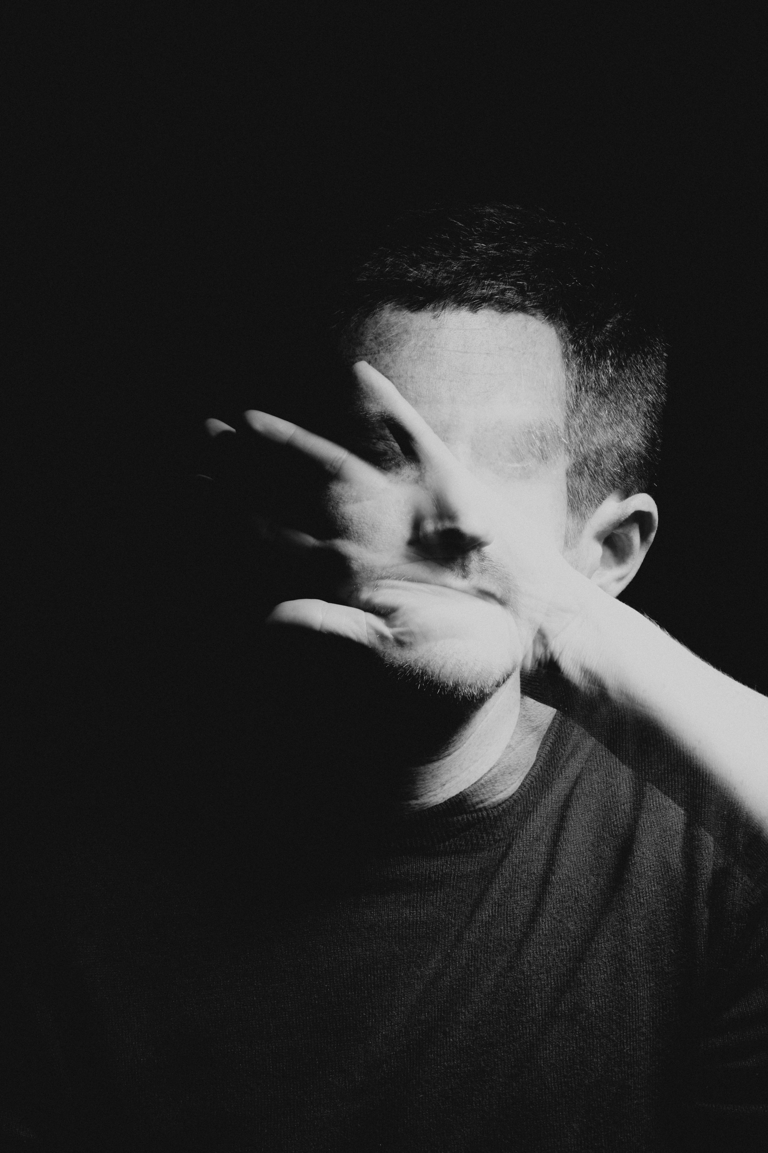 Adult man in a black and white double exposure portrait