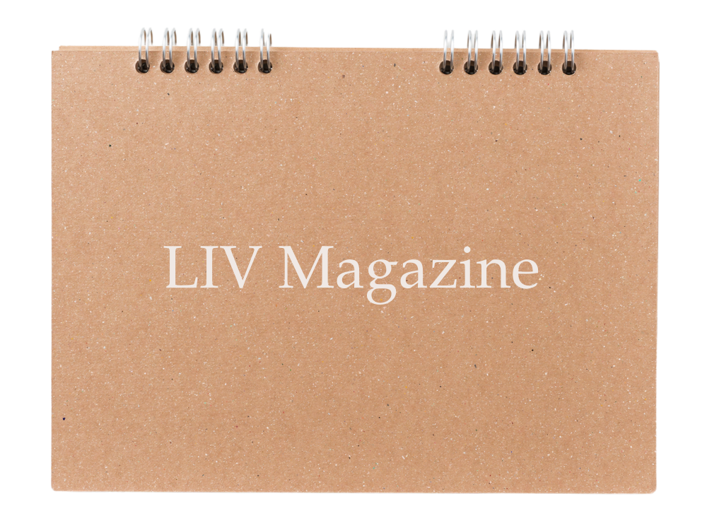 A spiral-bound notebook with a brown, textured cover displaying the text 'LIV Magazine' in white.