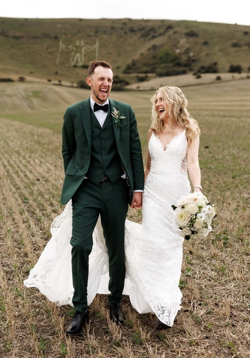 Bride and groom with neutral bouquet