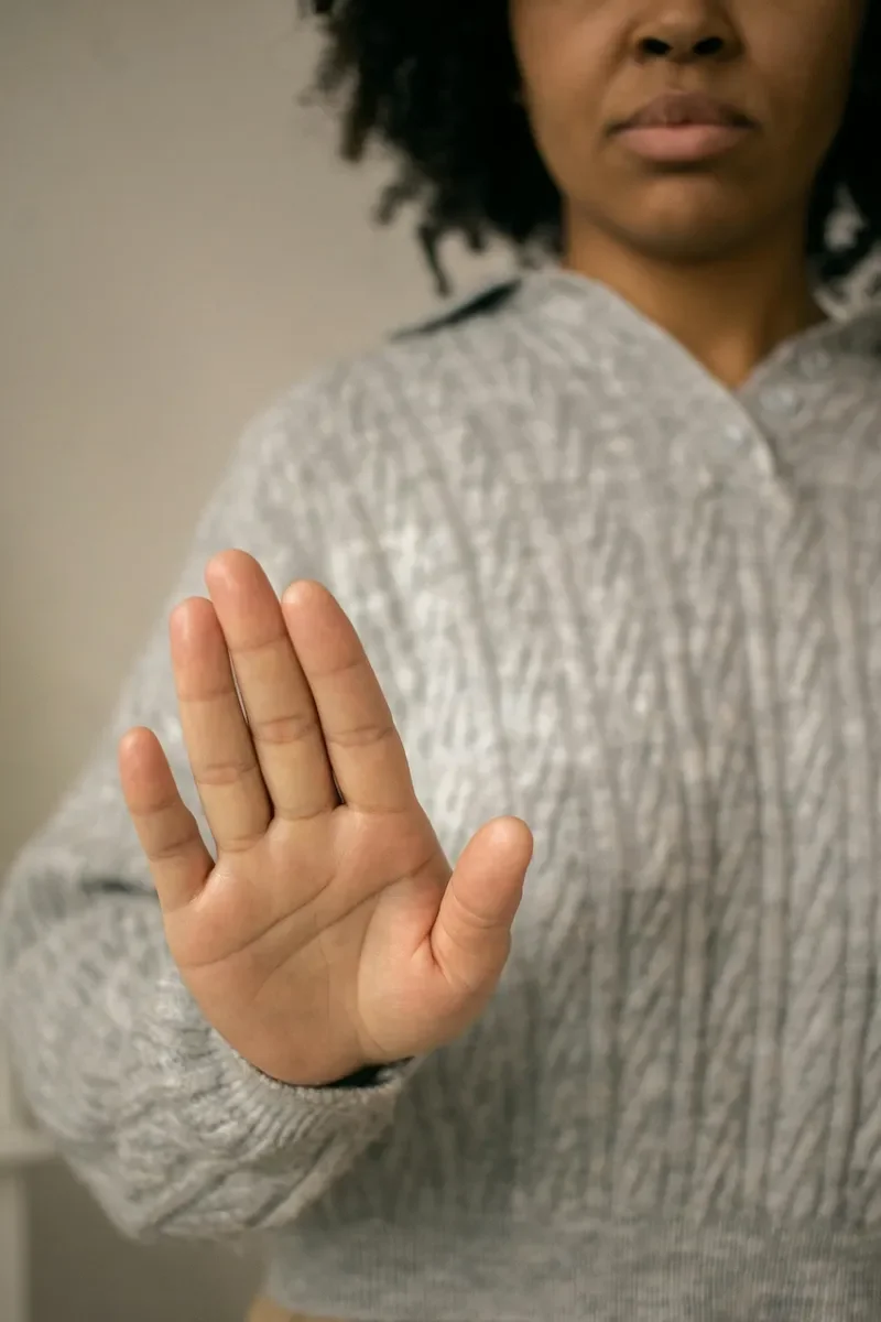 woman holding out hand in front of her