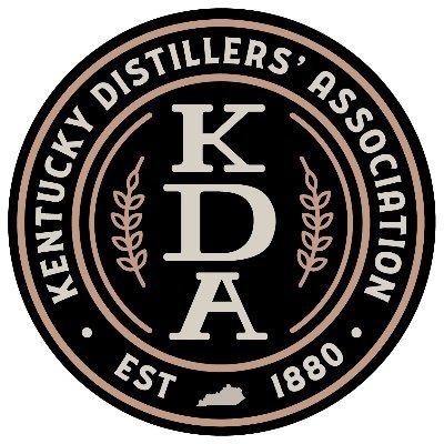 Logo of Kentucky Distillers' Association with initials KDA, established in 1880, featuring a black and bronze color scheme and floral accents.