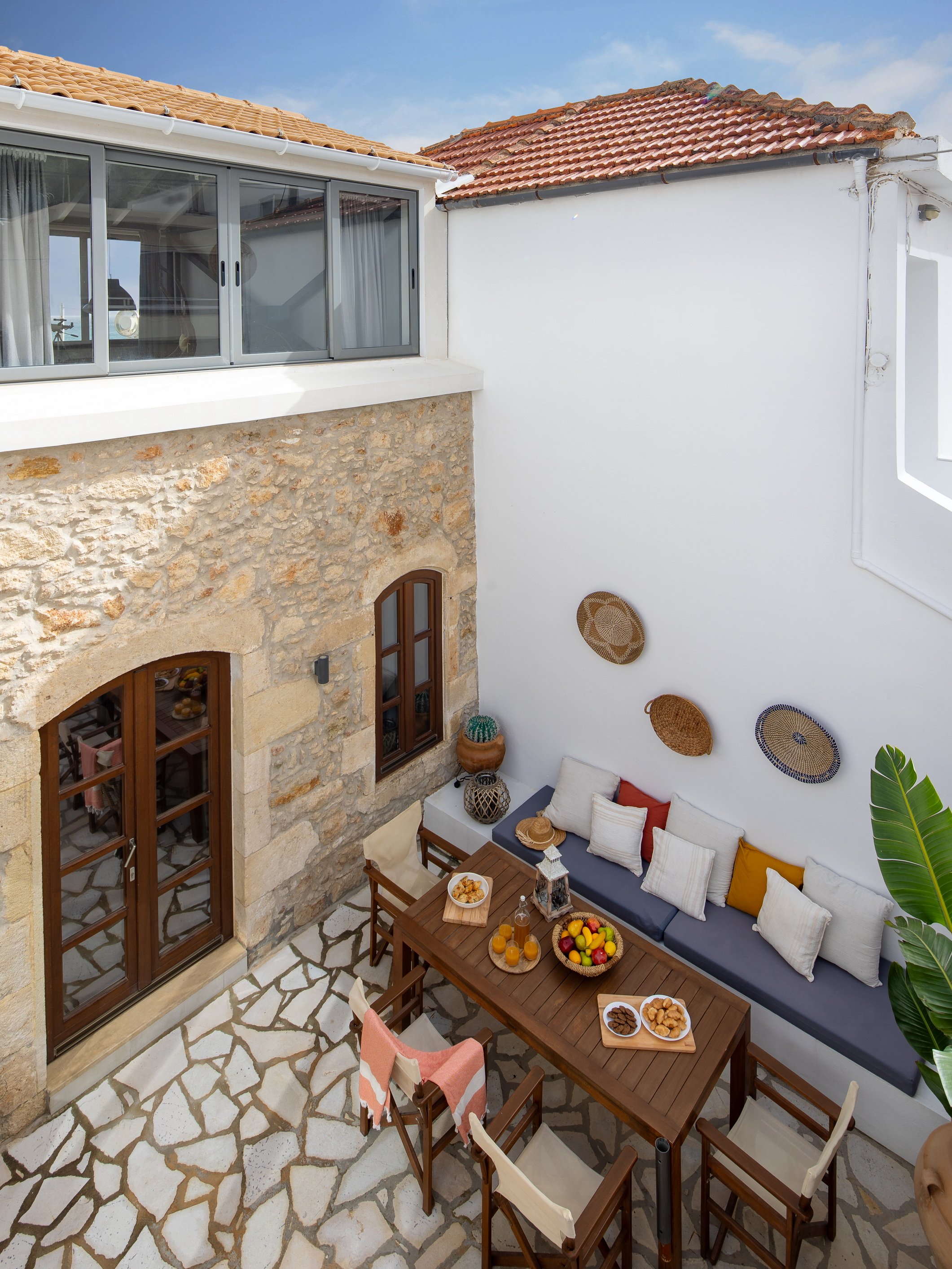 Spacious backyard patio with outdoor dining area and BBQ