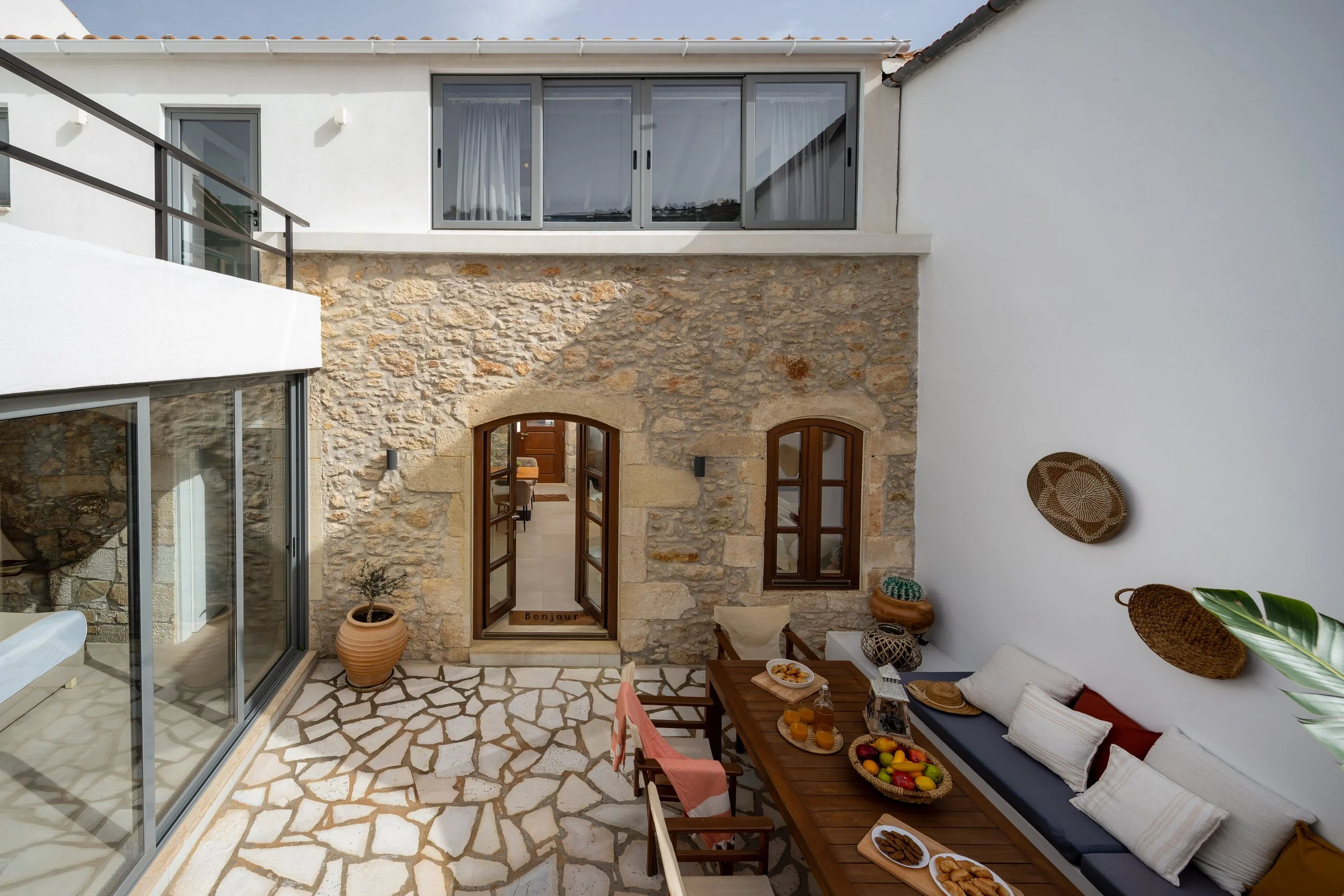 Spacious backyard patio with outdoor dining area and BBQ