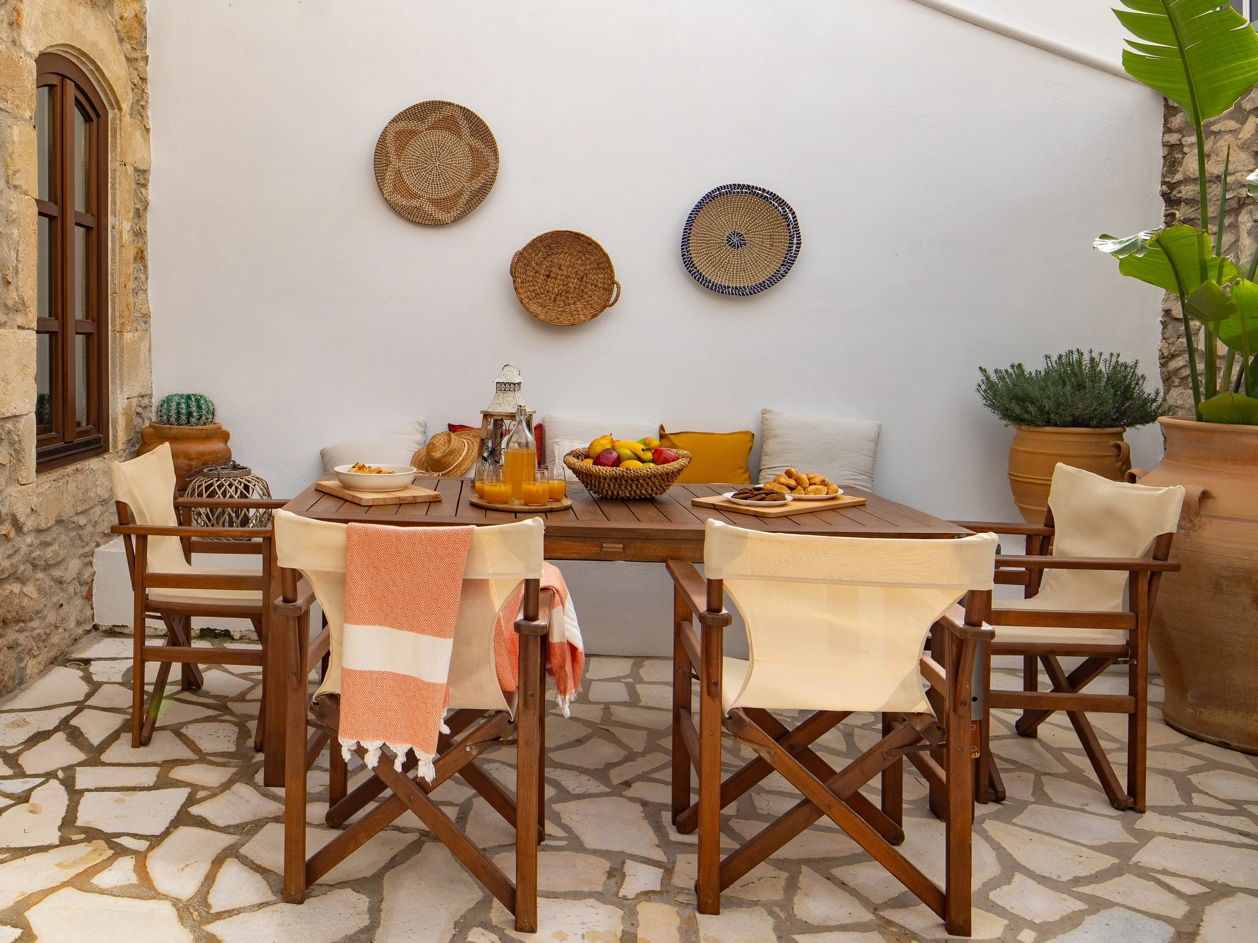 Spacious backyard patio with outdoor dining area and BBQ