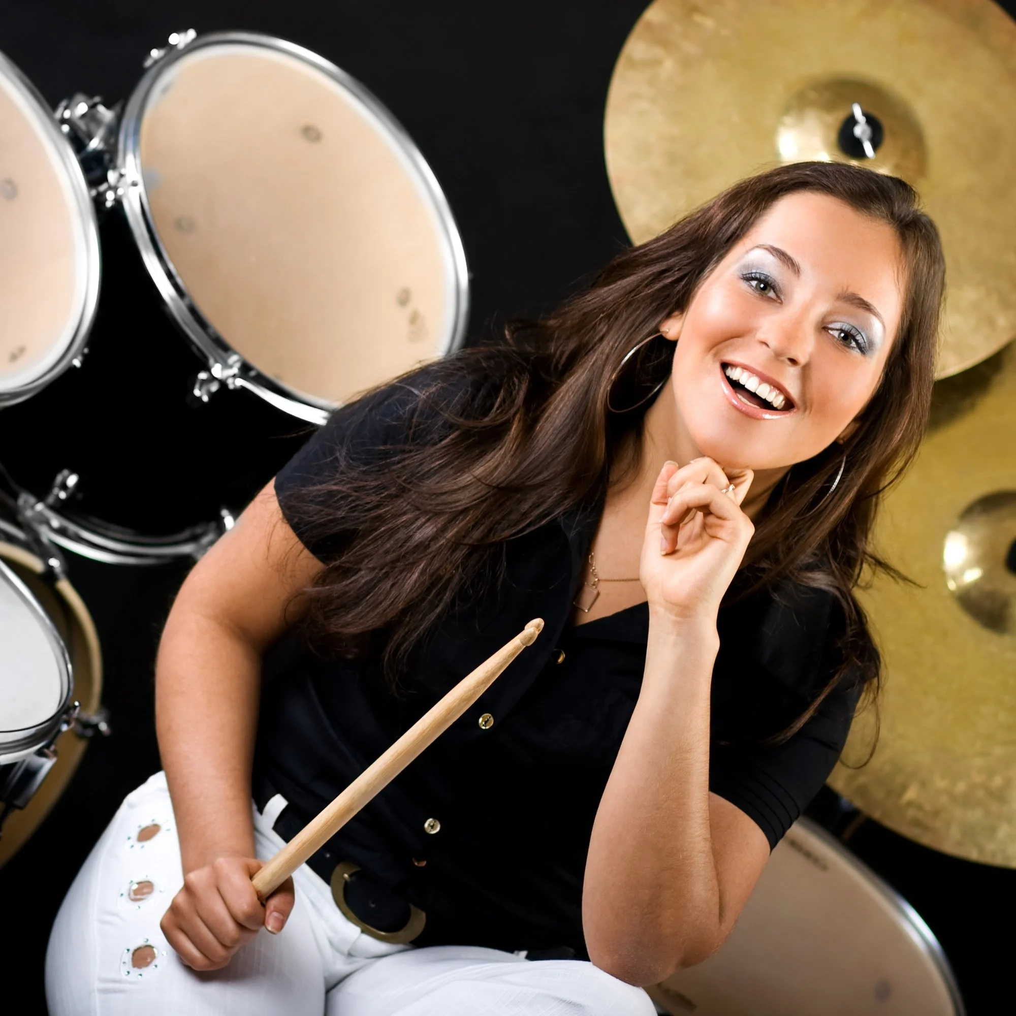 Student practicing beginner drum fill on kit using rudiments during private in-home drum lesson in South Bay.