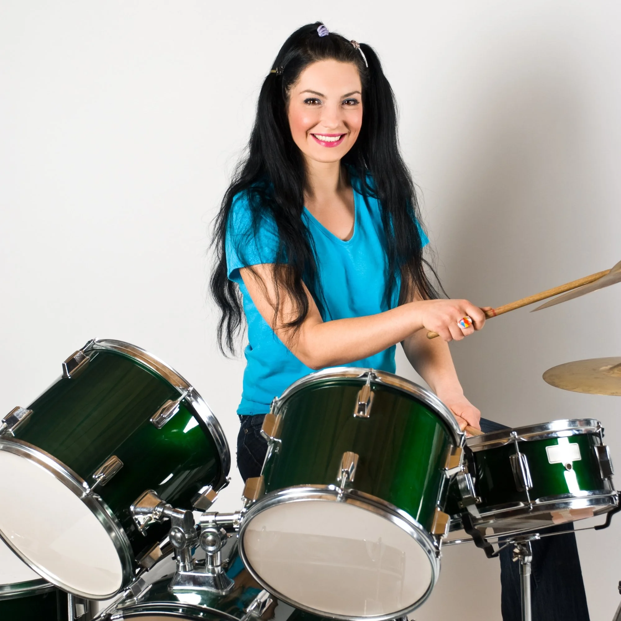 Student playing drum kit at home during private in-home lesson in South Bay, CA