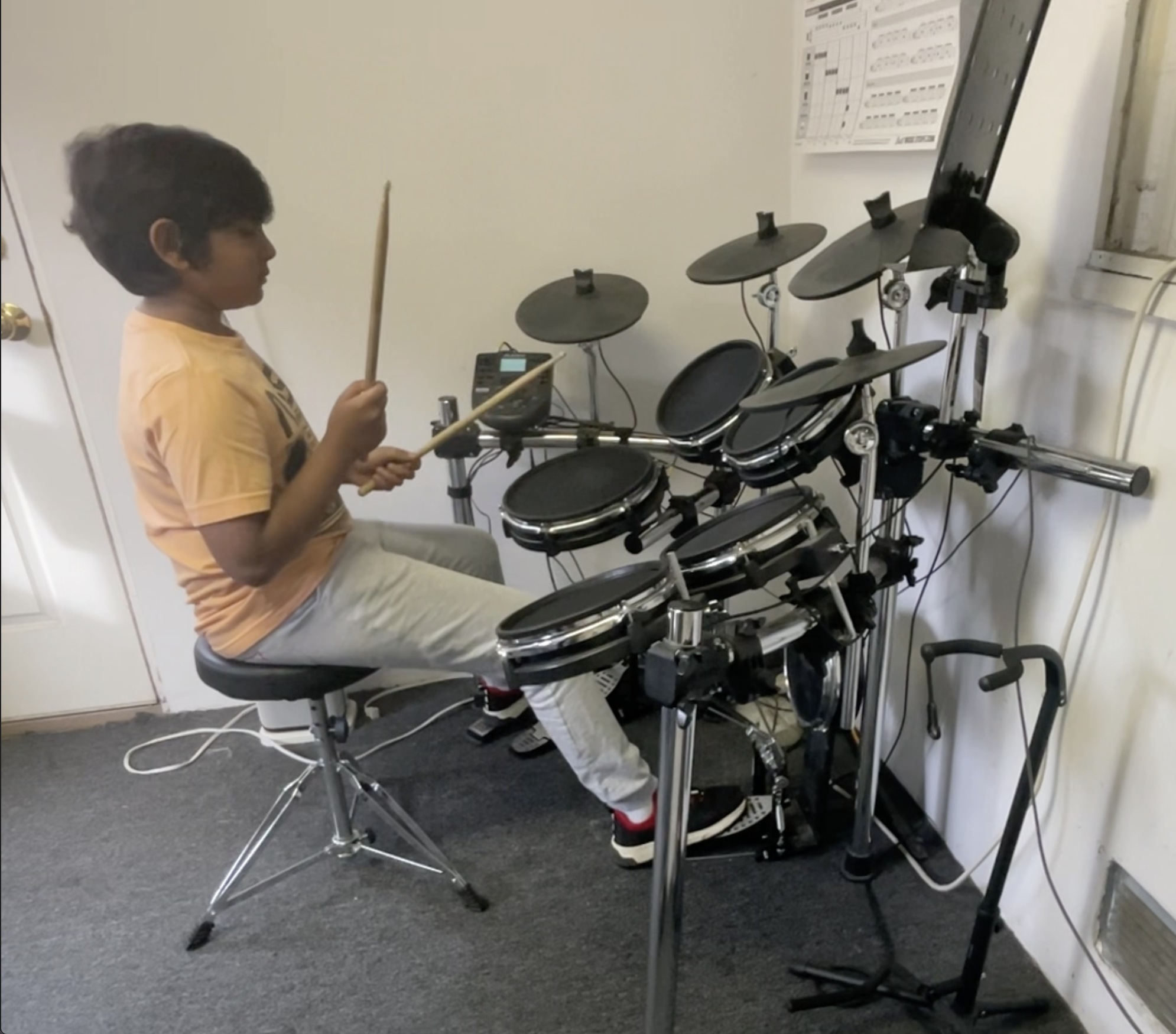 Student working on coordination-focused drum routine during private in-home lesson in the South Bay area