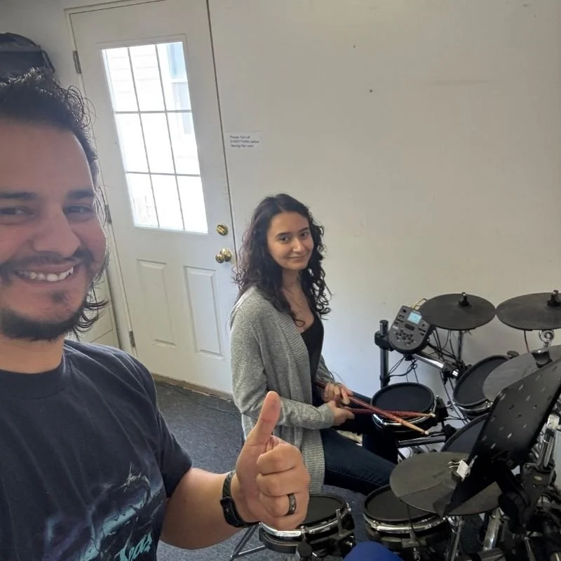 Beginner drummer practicing routine with private drum teacher during in-home lesson in South Bay area