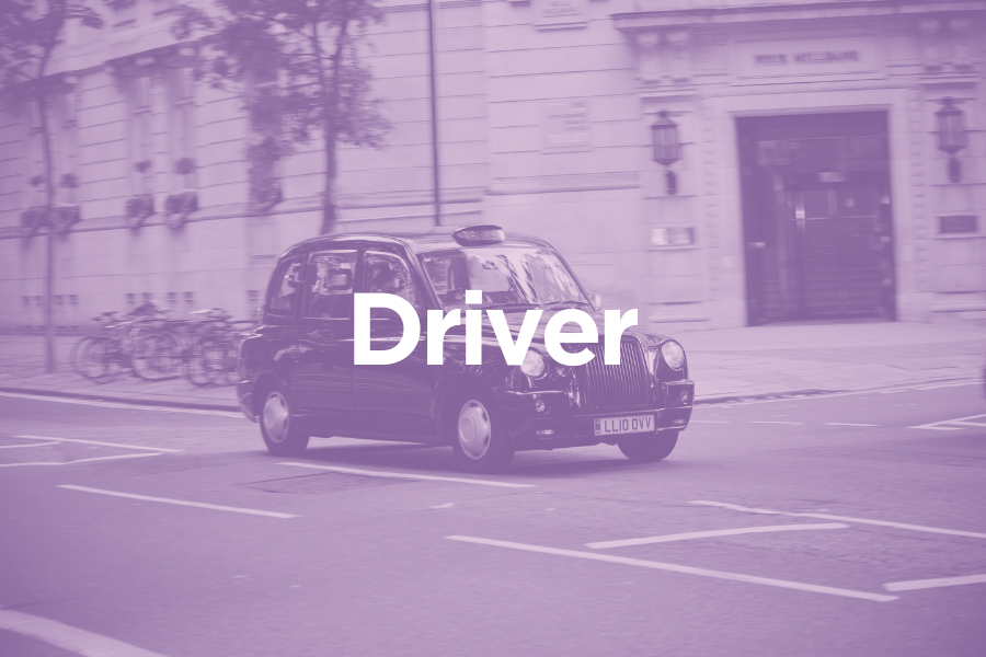 Black Taxi car driving on city street with buildings in background, overlaid with text "GTM Taxis".