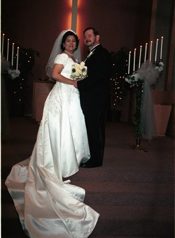 Bride and groom posing at a wedding ceremony in a church.
