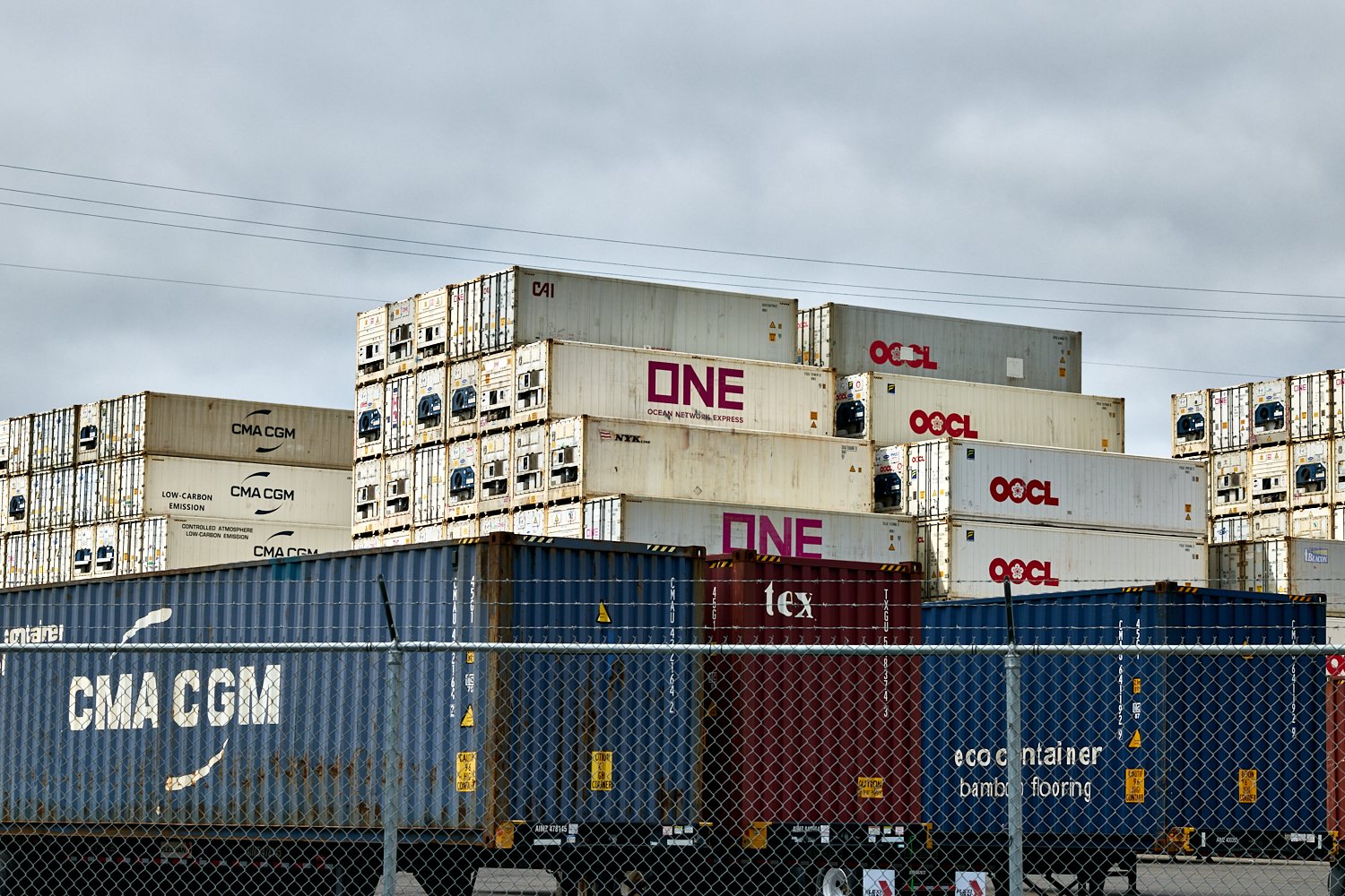 Vibrant intermodal shipping containers stacked at a Seattle terminal—perfect for logistics and supply chain storytelling.