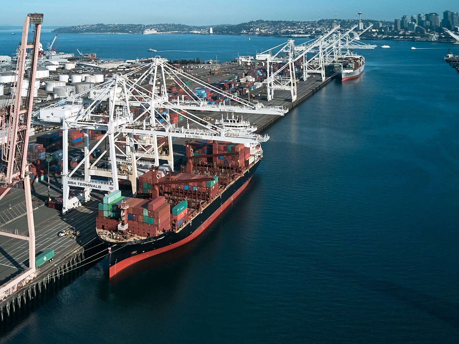 Aerial view of SSA Terminals at the Port of Seattle, featuring container ships and maritime logistics in Elliott Bay.