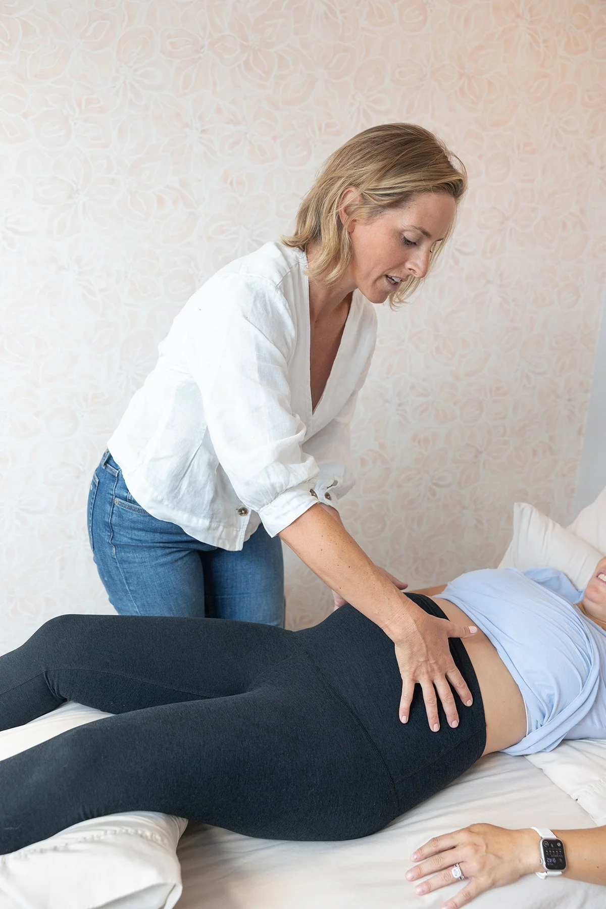 Dr. Liz Simons of Terra Wellness Physical Therapy works hands on with a pregnant patient.