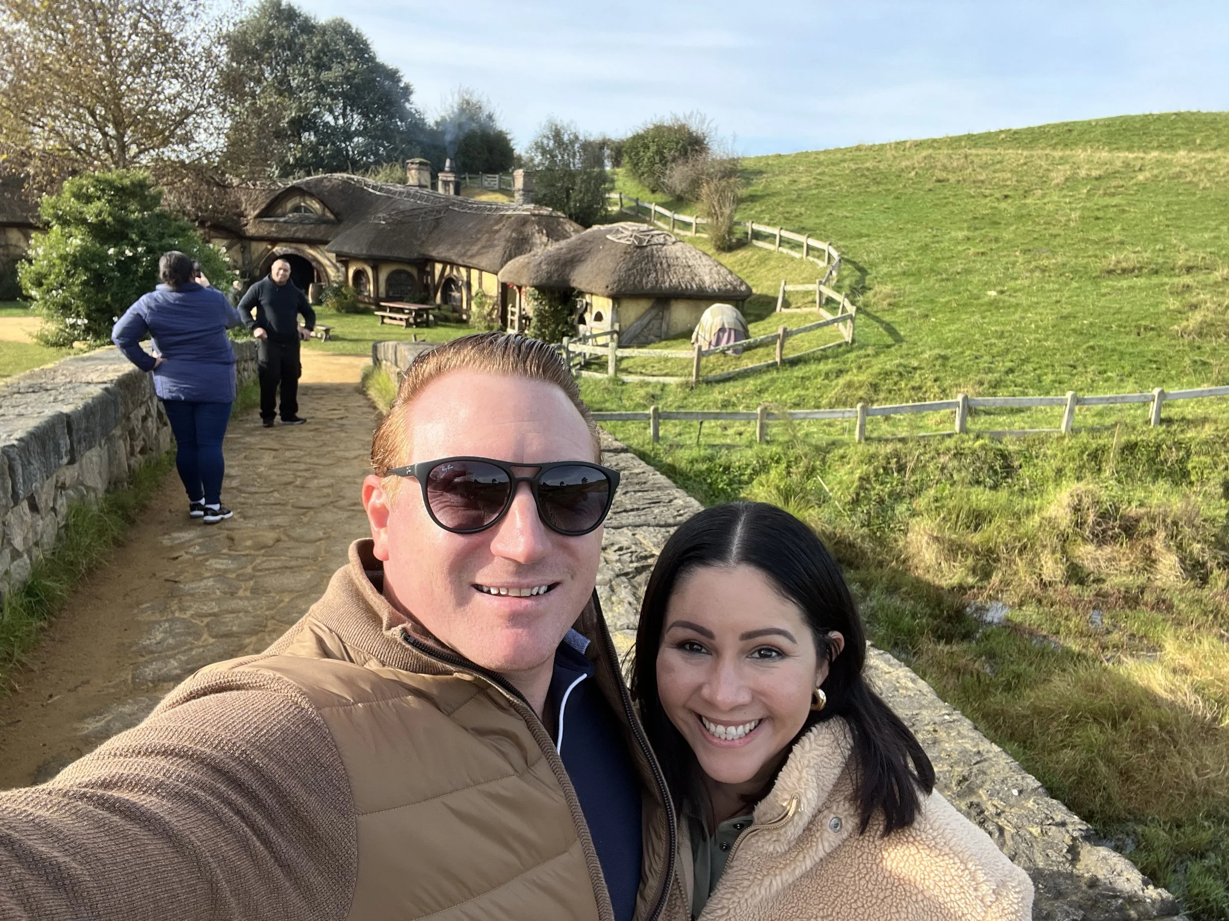 Woodrow Bell with his wife Carmen traveling in New Zealand and visiting Hobiton.