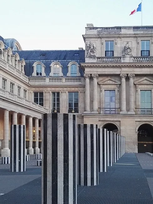 Colonnes de Buren by Daniel Buren in Paris France. (Image by Fred Romero)