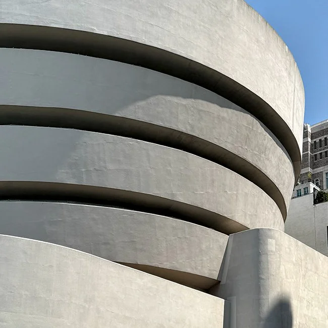 the guggenheim museum by Frank Lloyd Wright in NYC