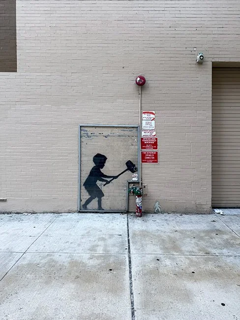 Hammer Boy by artist Bansky in New York CIty.