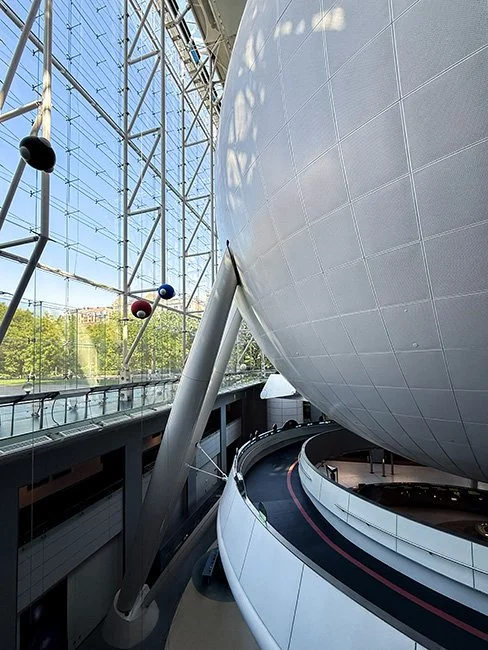 The Rose Center for Earth and Space by Polshek Partnership, now known as Ennead Architects cantilevered over the High Line in New York City.