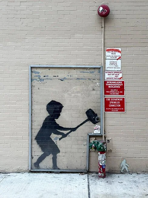 Hammer Boy by artist Bansky in New York CIty.