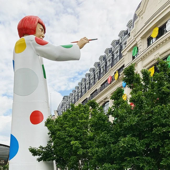 Yayoi Kusama sculpture painting dots on the Louis Vuitton Headquarters in Paris.