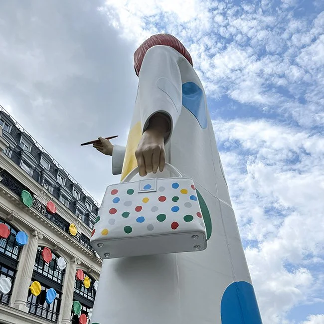 Yayoi Kusama sculpture painting dots on the Louis Vuitton Headquarters in Paris.