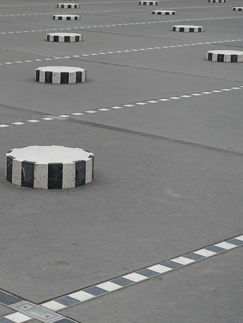 Colonnes de Buren by Daniel Buren in Paris France. (Image by Guilhem Vellut)