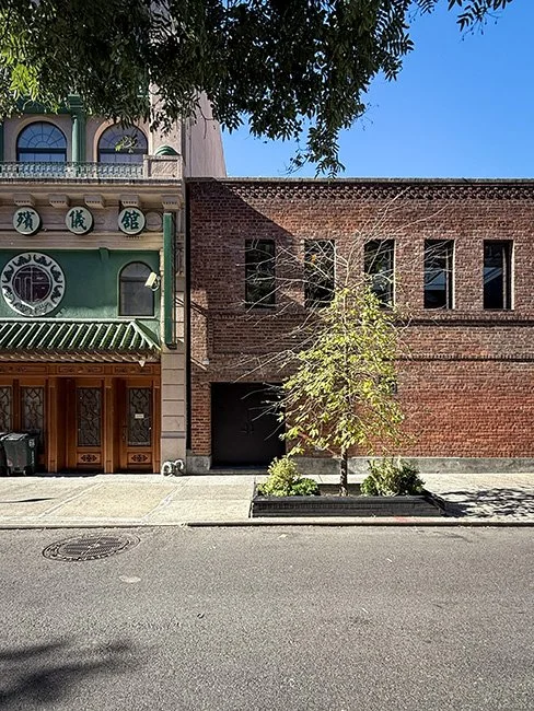 Front view of the Metrograph Theater building in New York City.