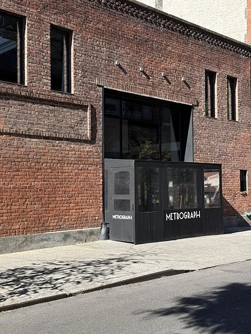 Front view of the Metrograph Theater building in New York City.