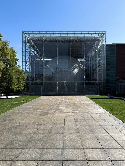 The Rose Center for Earth and Space by Polshek Partnership, now known as Ennead Architects cantilevered over the High Line in New York City.