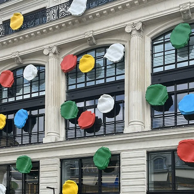 Yayoi Kusama sculpture painting dots on the Louis Vuitton Headquarters in Paris.
