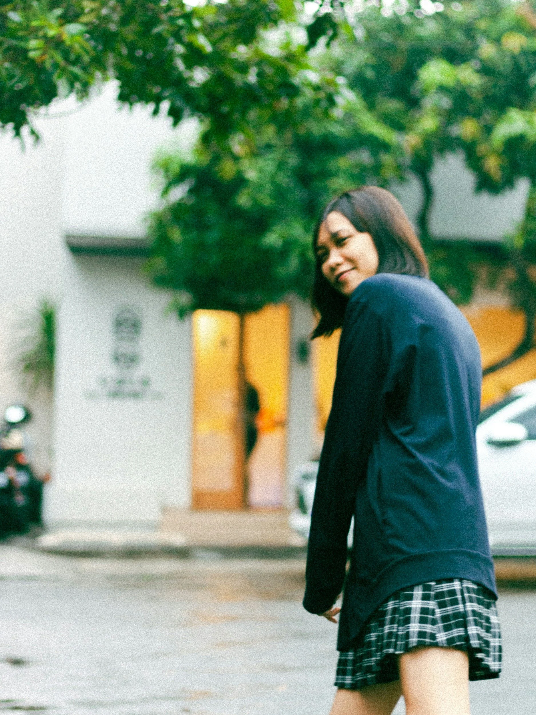 young woman walking down street