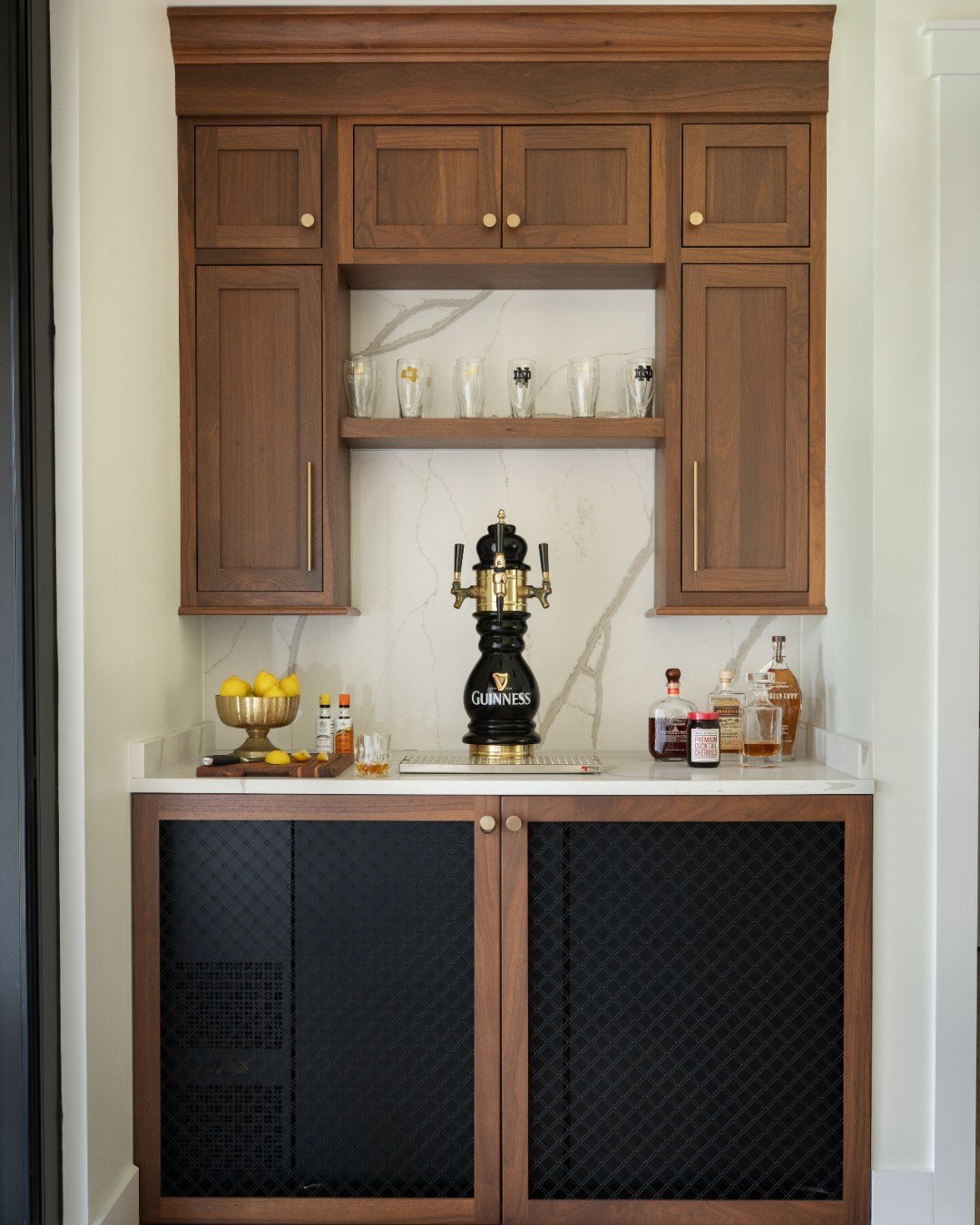 A custom bar fit for ND alums and a perfectly poured Guinness 🍀 Whether it&rsquo;s game day or St. Patrick&rsquo;s Day, this setup is ready for a house full of friends and great traditions. 

Photography: @traci.shupert

#TheCloseToCampus #custombar
