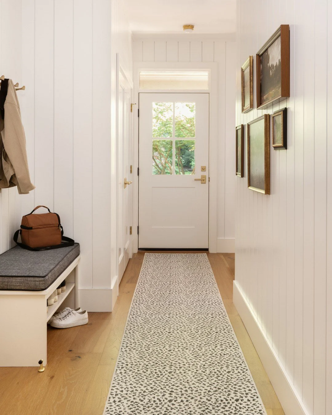 Trading heavy winter coats for light layers and bright spaces. This white nickel gap is giving us all the spring energy! ☀️

Builder: K.W. Yoder Construction
Photography: @traci.shupert

 #ThePatternedPlay #MudroomDesign #VerticalShiplap #CustomRunne