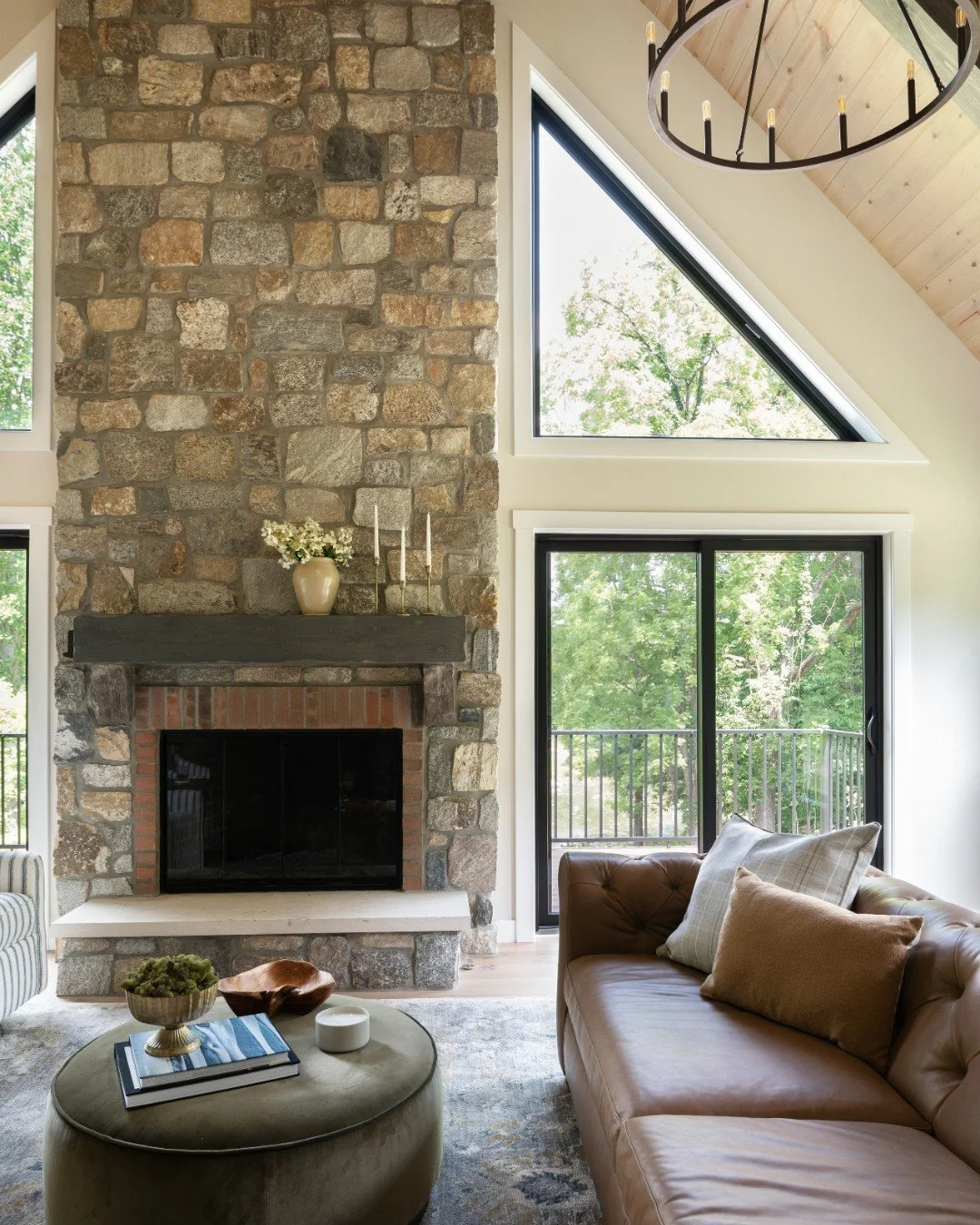 The secret to making a great room with high ceilings feel cozy? Texture. We layered stone, leather, and velvet to help the space feel warm and inviting.

Photography: @traci.shupert

#FreshInteriors #LightandBright #FireplaceDesign #StoneFireplace #L