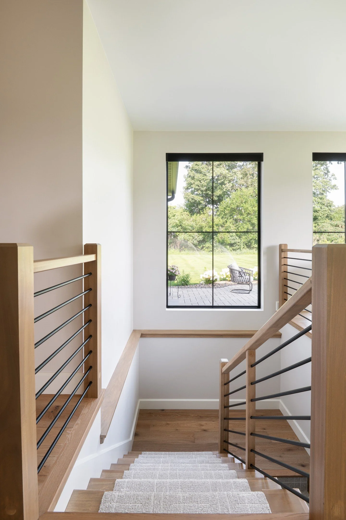 Seamless design is in the details. From the spindle shapes and railing profiles to the stain finish and custom runner, every element of this stairwell was thoughtfully designed by our team to connect the levels in this home effortlessly.

Photography