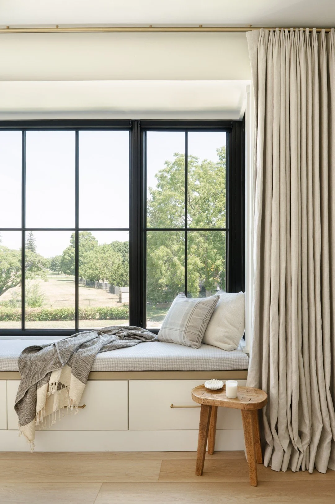 Interior design for a living room in a house close to the notre dame campus in indiana with a window nook and grey curtains