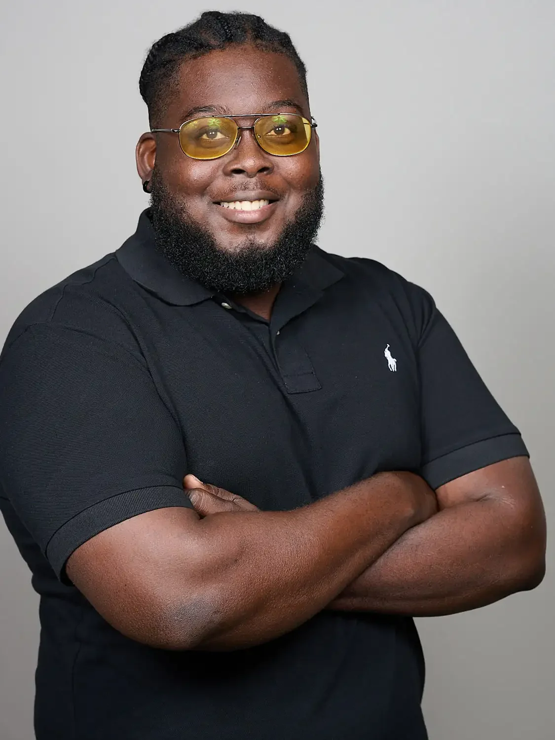 Professional headshot of a man in a studio setup looking friendly and confident perfect for professional headshot.