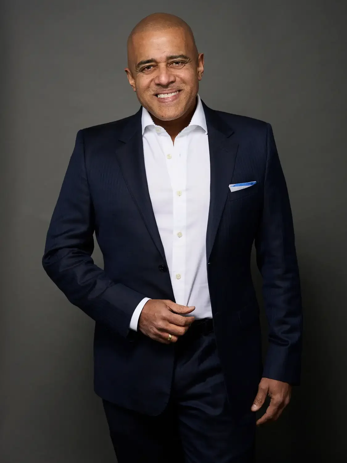 Professional portrait of a man CEO casual version smiling photographed in a photo studio.