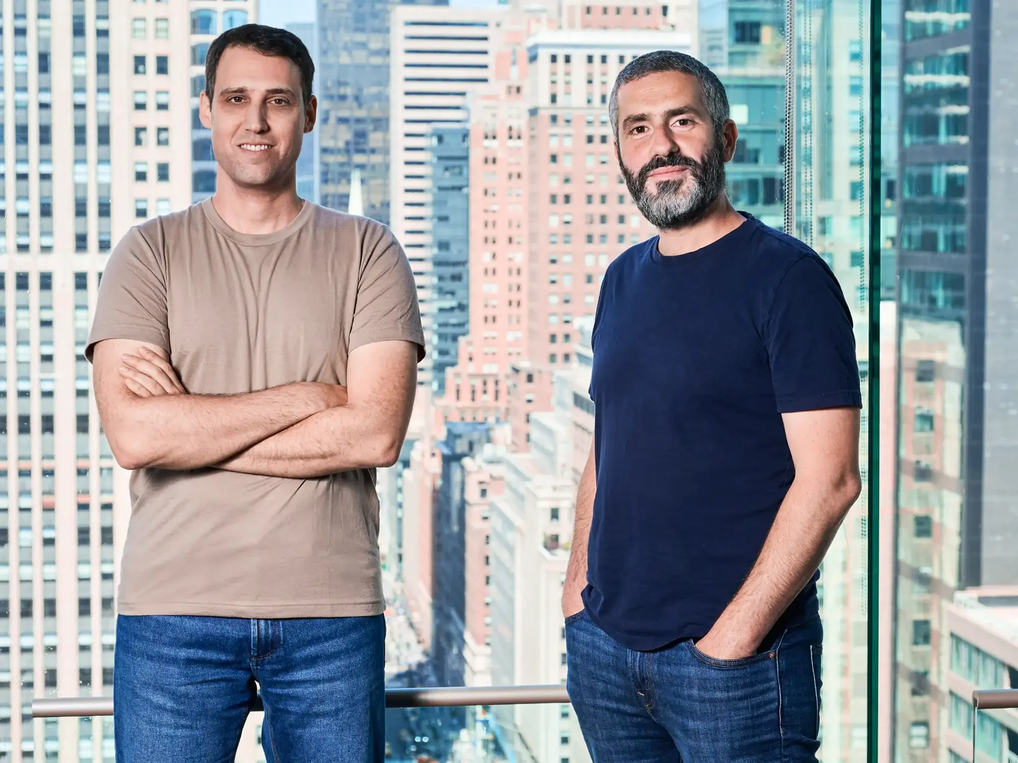 Portrait of Founder and CEO of a tech company photographed in their office space with a skyline view of New -York
