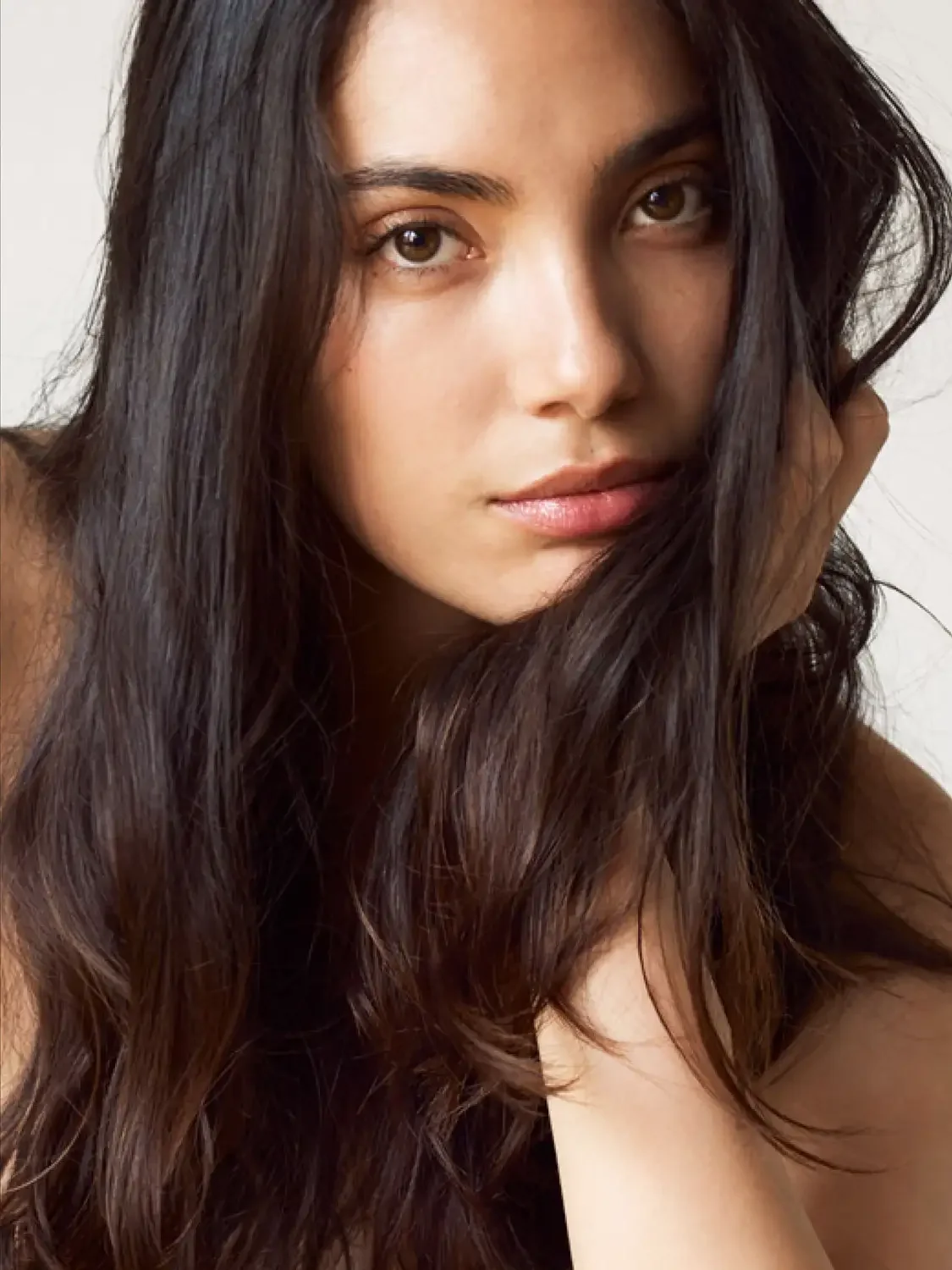 Close up photograph of a young beautiful looking woman.